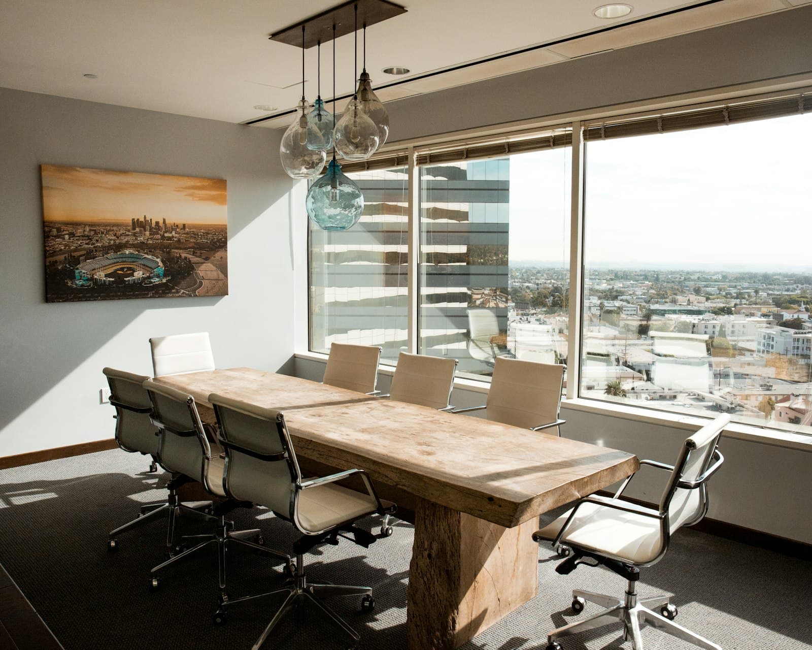 Conference room with a long table and glass walls