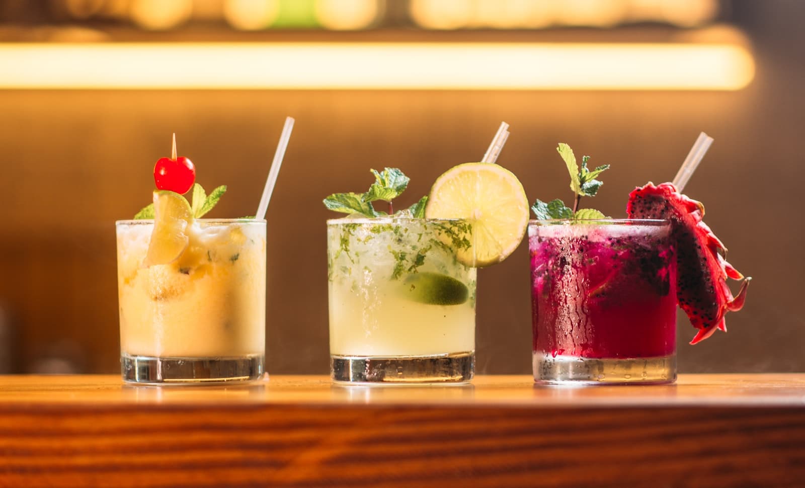 Craft cocktail garnished with fresh herbs