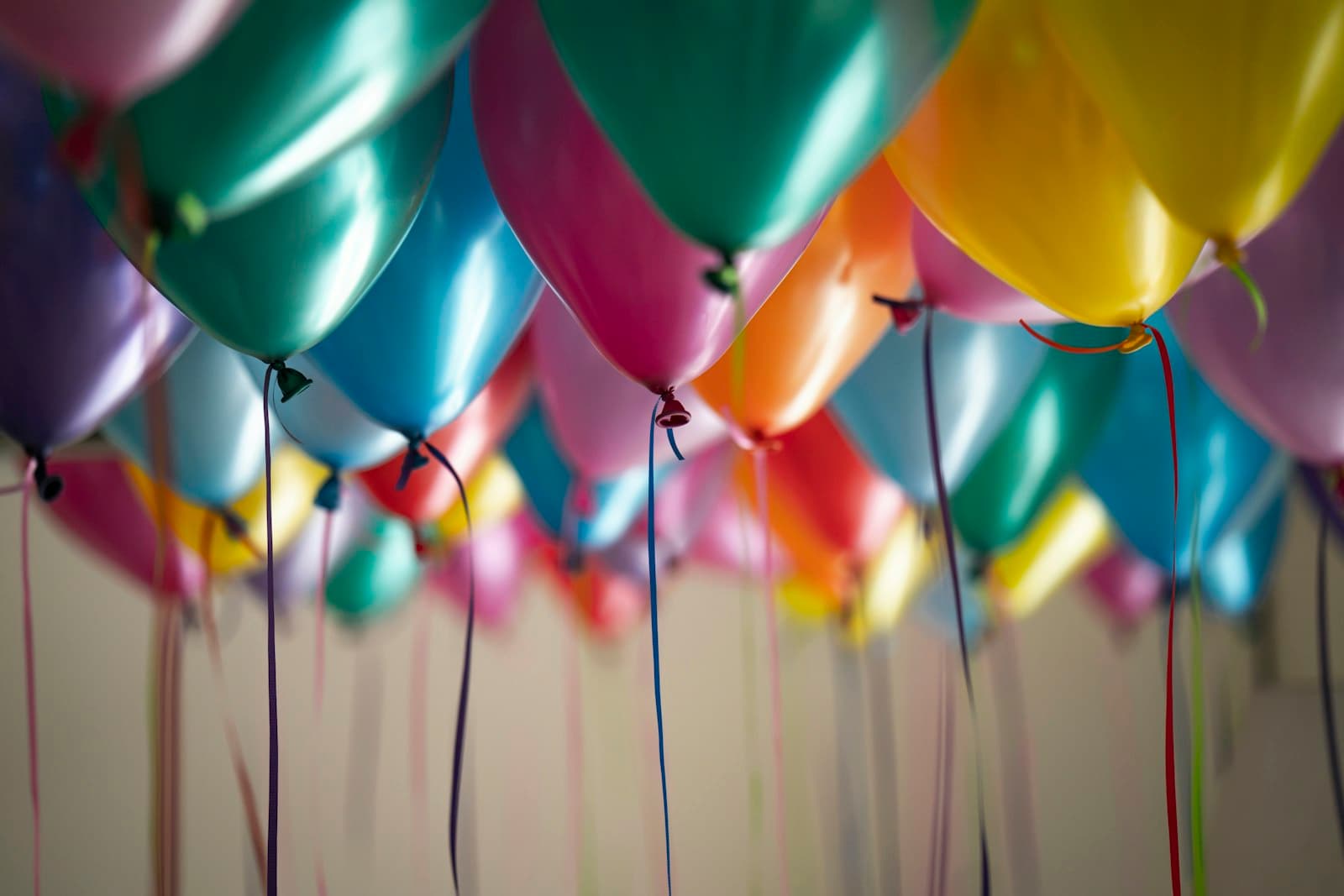 Colorful paper lanterns strung over a courtyard at night