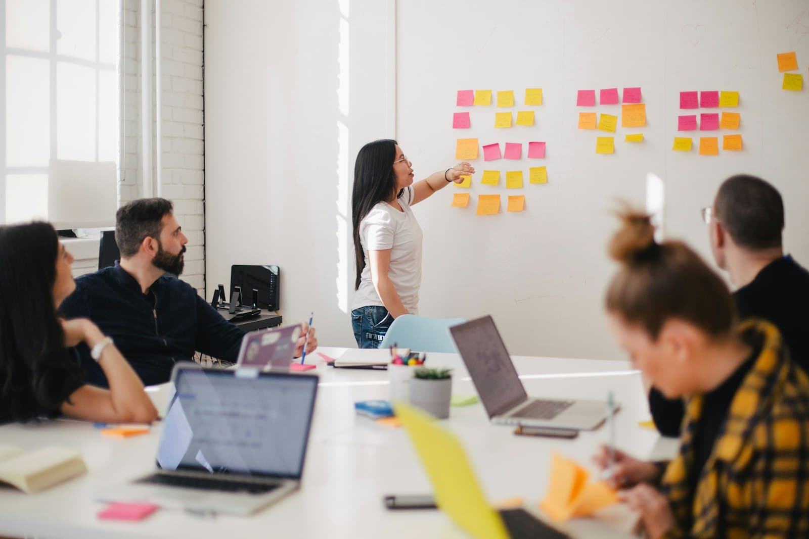 Colleagues collaborating in a bright meeting room