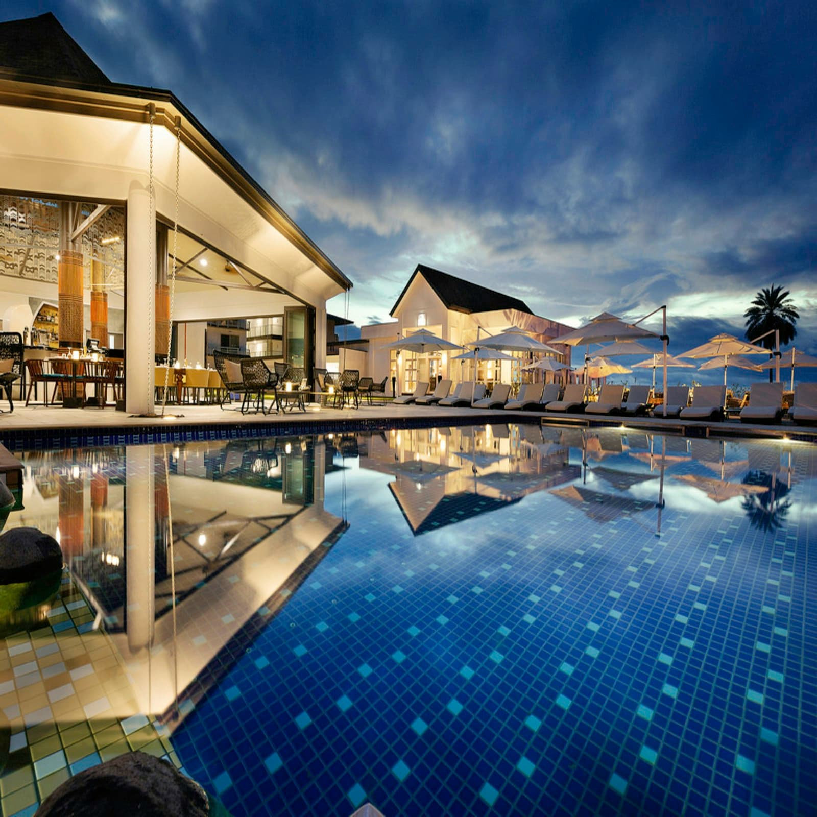 VillaVista resort walkway lit at dusk