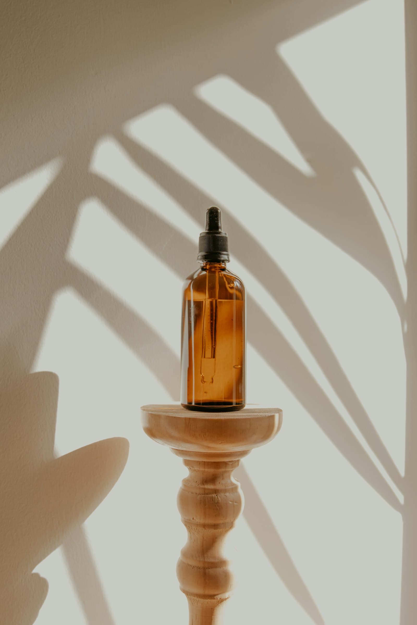 Spa oils and botanicals arranged on a plate